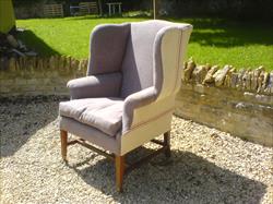 George III style wing chair made by Howard and Sons.jpg